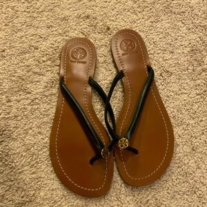 Black thin strapped flip flops